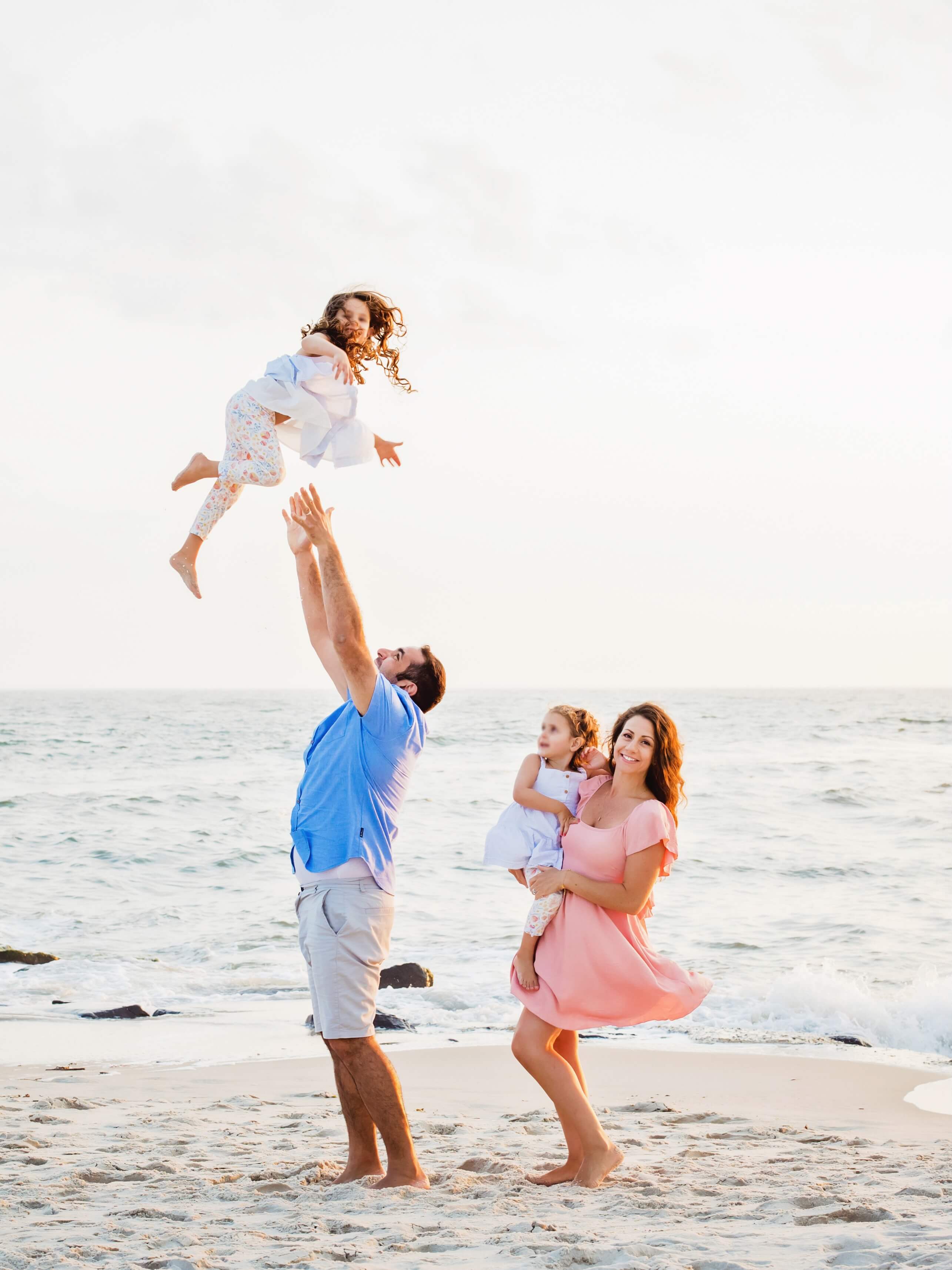 A family playing together on the beach